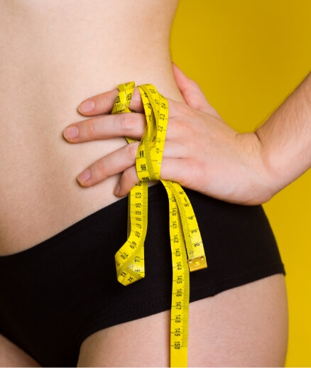 girl-measures-her-volumes-with-a-centimeter-2023-11-27-05-34-36-utc (1)