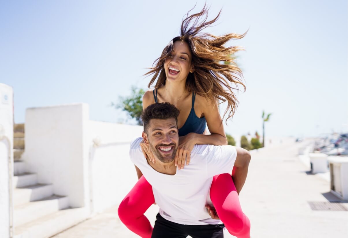 man-carrying-his-girlfriend-on-piggyback-wearing-s-2023-11-27-05-28-36-utc (1)