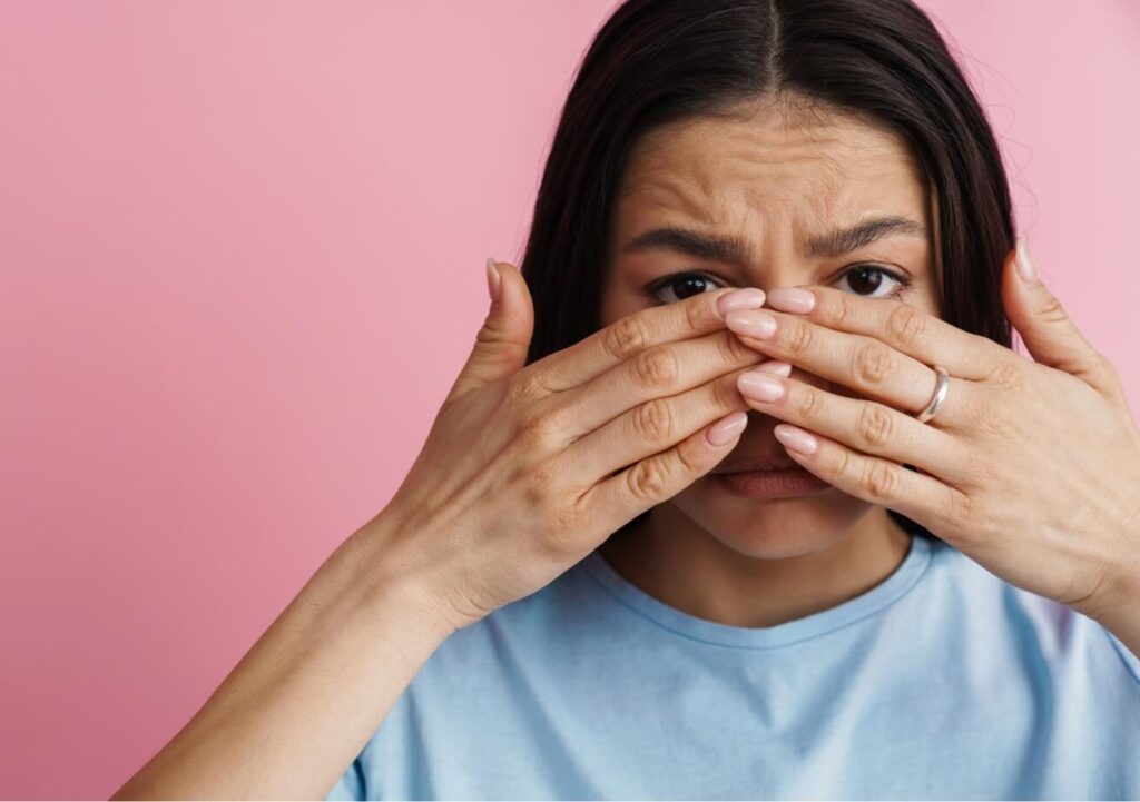young-hispanic-scared-woman-covering-her-face-and-2023-11-27-05-19-55-utc (1)