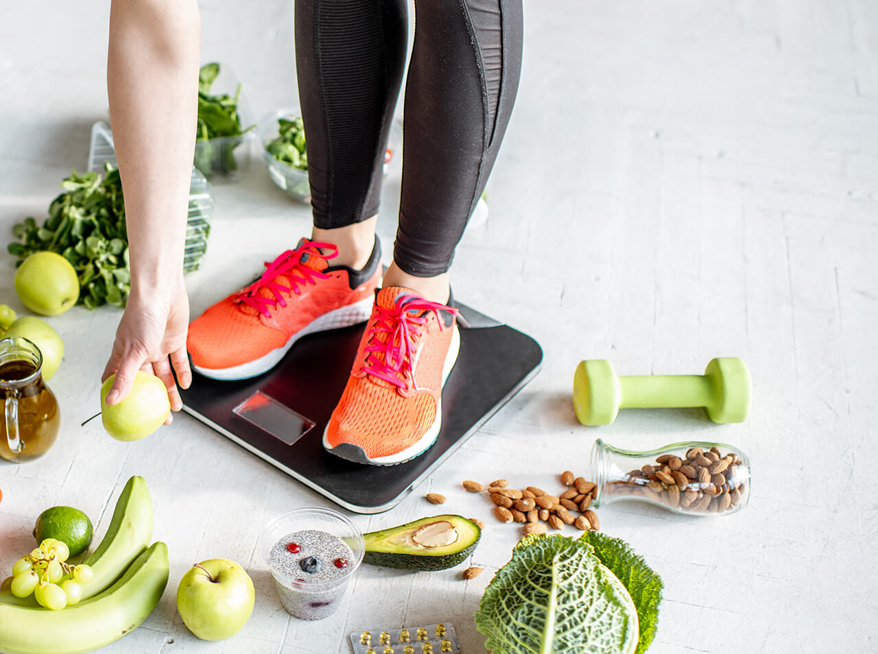 sports-woman-weighing-with-healthy-food-around-2023-11-27-05-30-23-utc (1)