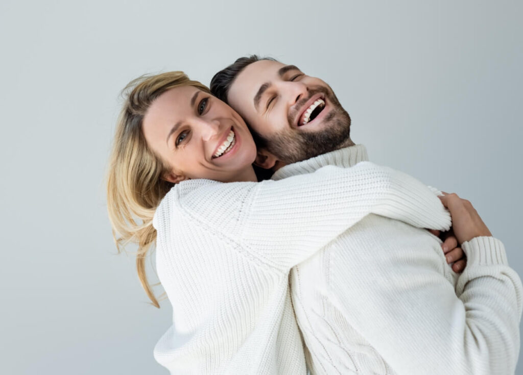 Positive blonde woman in white knitted sweater hug 2024 11 13 23 44 28 utc (1)